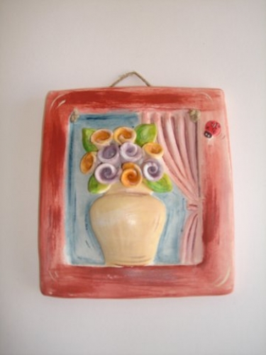 Hand-painted Ceramic Repousse plate.