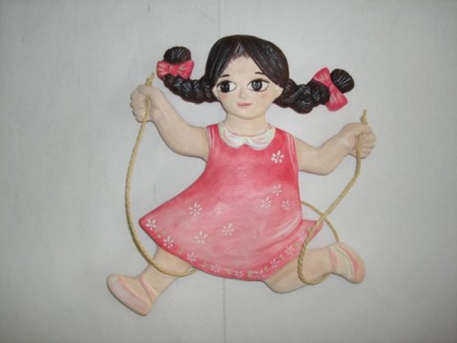 Handmade ceramic figurine “little girl playing”.