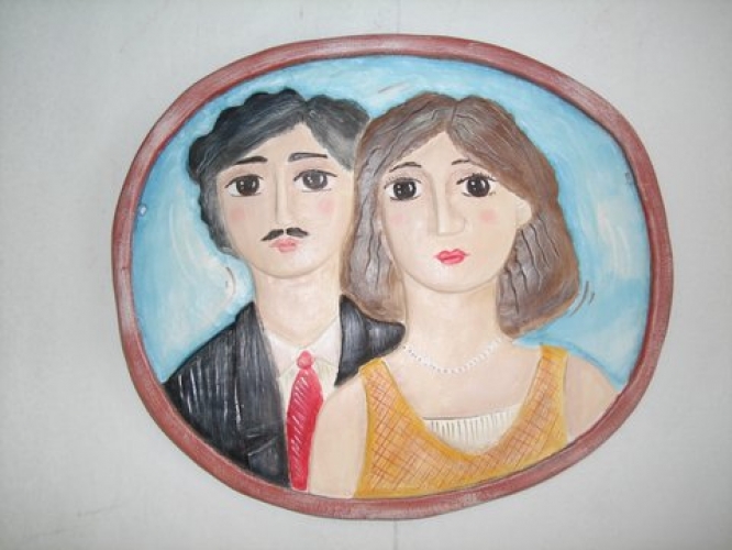 Handmade ceramic repousse plate.